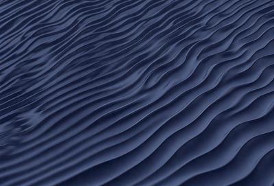 The primary subject of the image is a blue ocean with waves. The setting is the ocean, and the visual style is a photo. The dominant colors are blue and white, creating a calm and serene atmosphere.