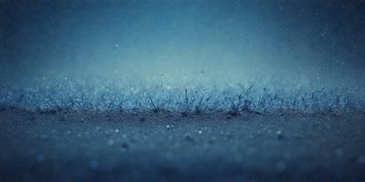 The primary subject of the image is a group of small, water droplet-like objects, possibly frozen water or ice crystals, scattered across a surface. The setting appears to be a dark, possibly blue, background, which contrasts with the bright, shiny appearance of the water droplets. The visual style of the image is a close-up, focusing on the details of the water droplets. The colors and mood of the image are predominantly dark and moody, with the brightness of the water droplets providing a contrasting element.