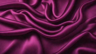The primary subject of the image is a purple fabric, which is the main object, scene, or focus of the image. The setting or background is a purple cloth, and the visual style is a photo. The colors and mood of the image are predominantly purple, creating a calm and soothing atmosphere.