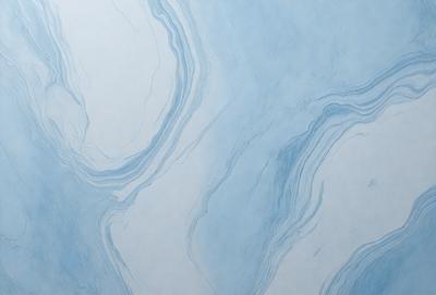 The primary subject of the image is a blue and white swirling pattern, which appears to be a painting or drawing. The setting is a white wall, and the visual style is artistic. The dominant colors are blue and white, creating a calming and serene atmosphere.