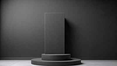 The primary subject of the image is a large, gray, square-shaped object, which appears to be a sculpture or a piece of art. The setting is a black wall, which serves as the background for the artwork. The visual style of the image is a black and white photo, giving it a classic and timeless appearance. The colors and mood of the image are predominantly dark and moody, with the gray sculpture contrasting against the black wall.