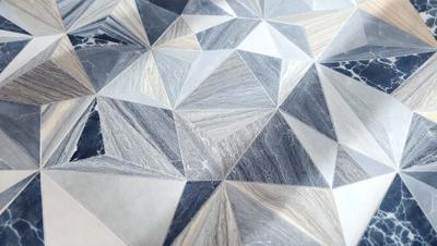 The primary subject of the image is a patterned surface, which appears to be a marble or stone tile. The setting is a room with a white background, and the visual style is a combination of photo and digital art. The colors and mood of the image are predominantly gray and white, giving it a clean and modern appearance.