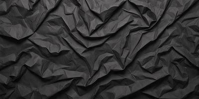 The primary subject of the image is a black and white paper, which is the main object, scene, or focus of the image. The setting is a black background, and the visual style is a close-up of the paper. The colors and mood of the image are predominantly black and white, giving it a classic and timeless appearance.