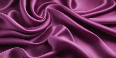 The primary subject of the image is a purple fabric, which is the main object, scene, or focus of the image. The setting is a close-up view of the fabric, showcasing its texture and details. The visual style is a photo, capturing the purple fabric in its natural state. The colors and mood of the image are predominantly purple, creating a calm and soothing atmosphere.