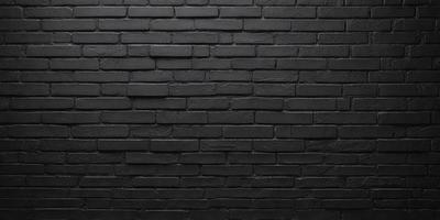 The primary subject of the image is a black brick wall. The setting is a dark room, and the visual style is a close-up of the brick wall. The colors and mood of the image are predominantly dark, with the black brick wall being the main focus.