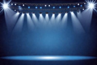 The primary subject of the image is a stage with a blue background. The stage is illuminated by a series of lights, creating a bright and dramatic atmosphere. The setting is a theater or performance venue, and the visual style is a combination of photo and digital art. The dominant colors are blue and white, with the blue background and the lights creating a striking contrast. The overall mood of the image is one of excitement and anticipation, as the stage is prepared for a performance or event.