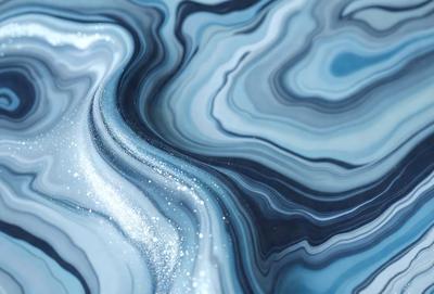 The primary subject of the image is a blue and white swirling pattern, which appears to be a digital art or illustration. The setting is a blue and white marbled surface, which adds to the overall visual style. The colors and mood of the image are predominantly blue and white, creating a calm and serene atmosphere.
