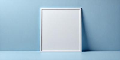 The primary subject of the image is a white square frame, which is placed on a blue surface. The setting appears to be a studio or a similar environment, as the frame is propped up against a wall. The visual style of the image is a combination of photo and digital art, as it appears to be a photograph of a digital art piece. The colors in the image are predominantly blue and white, creating a calm and serene atmosphere.