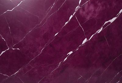 The primary subject of the image is a marble wall with a purple hue. The setting is a room with a purple marble wall, which serves as the background. The visual style is a close-up of the marble wall, showcasing its texture and color. The colors and mood of the image are predominantly purple, creating a calm and elegant atmosphere.