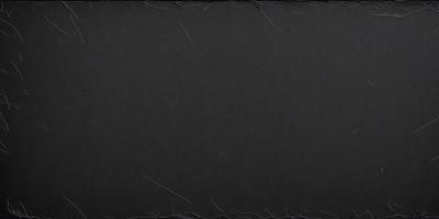 The primary subject of the image is a black background with a few white specks. The setting is a dark room, and the visual style is a black and white photo. The colors and mood of the image are predominantly dark and moody, with the black background and white specks creating a sense of depth and contrast.