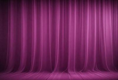 The primary subject of the image is a purple curtain, which is the main object, scene, or focus of the image. The setting is a stage or theater, with the curtains hanging down. The visual style is a photo, and the colors and mood are predominantly purple, creating a dramatic and theatrical atmosphere.