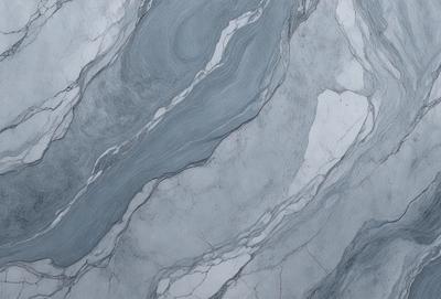 The primary subject of the image is a marble wall with a blue and white pattern. The setting is a room with a marble floor. The visual style is a close-up of the marble wall, showcasing its intricate design. The colors and mood of the image are predominantly blue and white, giving it a clean and elegant appearance.