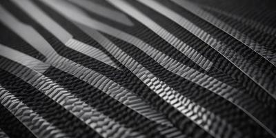 The primary subject of the image is a pattern of black and white stripes. The setting is a black background, which creates a striking contrast with the pattern. The visual style is a combination of a photo and digital art, as the stripes appear to be a blend of both. The colors and mood of the image are predominantly black and white, giving it a classic and timeless appearance.