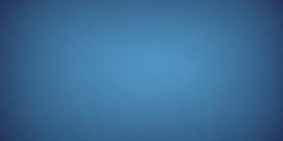 The primary subject of the image is a blue sky. The setting is a clear, cloudless day with no visible landmarks or objects. The visual style is a natural, outdoor scene. The colors and mood are predominantly blue, creating a calm and serene atmosphere.
