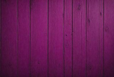 Purple wall with wooden planks.
