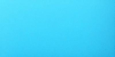 The primary subject of the image is a large, empty blue sky. The setting is a vast, open space with no visible landmarks or objects. The visual style is a natural, untouched landscape. The colors and mood are predominantly blue, creating a serene and peaceful atmosphere.