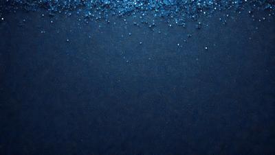 The primary subject of the image is a blue background with a pattern of blue and white beads. The setting is a dark blue surface, and the visual style appears to be a digital art or illustration. The dominant colors are blue and white, creating a calm and serene atmosphere.