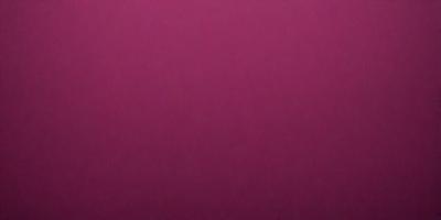 The primary subject of the image is a large, pink wall. The setting is a room with a pink background, and the visual style is a close-up of the wall. The dominant colors in the image are pink, and the overall atmosphere is warm and inviting.