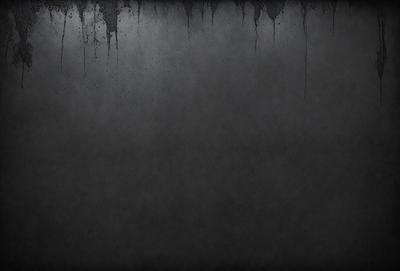 The primary subject of the image is a gray wall with a few black streaks. The setting is a room with a gray background. The visual style is a black and white photo. The colors and mood are dark and moody.