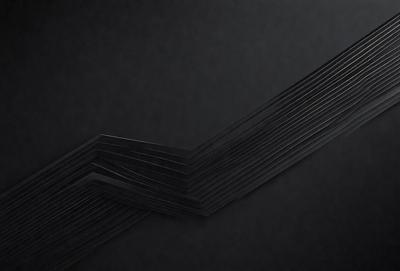 The primary subject of the image is a black background with a pattern of lines and shapes. The setting is a dark room, and the visual style appears to be a combination of digital art and illustration. The dominant colors are black and grey, creating a moody atmosphere.