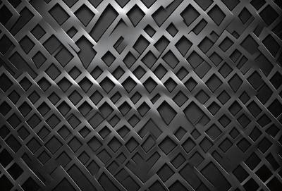The primary subject of the image is a black and white patterned wall. The setting is a dark room, and the visual style is a close-up of the pattern. The dominant colors are black and white, creating a moody atmosphere.