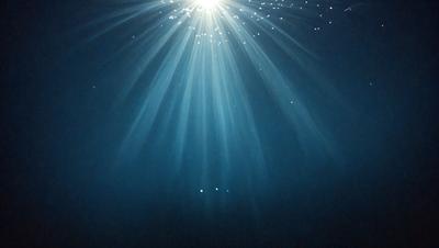The primary subject of the image is a bright light source, possibly a sun or a light bulb, shining through the water. The light creates a beautiful and mesmerizing effect, illuminating the water and creating a stunning visual display. The setting is underwater, with the light source shining through the water, creating a unique and captivating scene. The visual style of the image is a combination of photography and digital art, as the light source appears to be a digital creation, while the water and lighting effects are captured through photography. The colors and mood of the image are predominantly blue and white, with the bright light source creating a sense of wonder and awe.