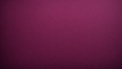 The primary subject of the image is a large, purple wall. The setting is a room with a purple background, and the visual style is a close-up of the wall. The colors and mood of the image are predominantly purple, creating a calm and serene atmosphere.