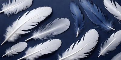 The primary subject of the image is a collection of white feathers. The feathers are arranged in a visually appealing manner, with some overlapping and others standing alone. The setting is a blue background, which provides a contrasting and complementary color to the white feathers. The visual style of the image is a close-up of the feathers, showcasing their intricate details and textures. The overall atmosphere of the image is serene and elegant, with the white feathers symbolizing purity and grace.