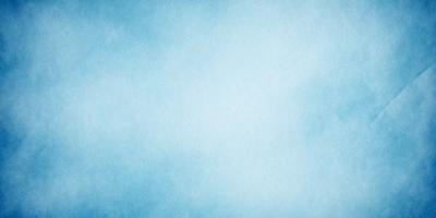 The primary subject of the image is a large, empty blue sky. The setting is a cloudy day, with the sky being the main focus of the image. The visual style is a natural, outdoor scene, and the colors and mood are serene and peaceful.