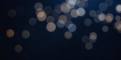 The primary subject of the image is a night sky filled with bright, colorful lights. The setting is a dark, starry night, with the lights creating a vibrant and lively atmosphere. The visual style of the image is a combination of a photo and digital art, as the lights are depicted in a way that resembles a painting or drawing. The colors and mood of the image are predominantly dark and moody, with the bright lights providing a contrasting and captivating element.