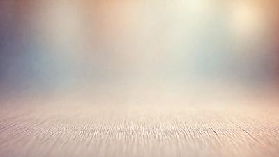 The primary subject of the image is a wooden floor with a patterned texture. The setting is a room with a blue background, and the visual style is a photo. The colors and mood of the image are predominantly blue and calm, creating a serene atmosphere.