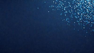 The primary subject of the image is a blue background with a pattern of white dots. The setting appears to be a dark, possibly underwater, environment. The visual style of the image is a combination of a photo and a digital art, creating a unique and intriguing appearance. The dominant colors in the image are blue and white, with the white dots adding a contrasting element to the overall atmosphere.