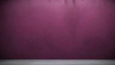 The primary subject of the image is a purple wall. The setting is a room with a purple wall, and the visual style is a photo. The dominant colors are purple and pink, creating a calm and soothing atmosphere.