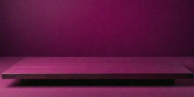The primary subject of the image is a wooden table with a purple surface. The setting is a purple wall, which creates a unique and visually striking backdrop. The visual style of the image is a photo, capturing the wooden table and the purple wall in detail. The colors and mood of the image are predominantly purple, giving it a calm and serene atmosphere.