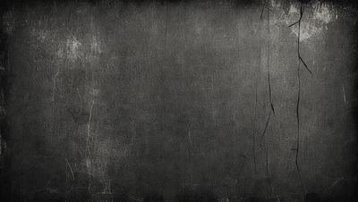 The primary subject of the image is a black and white photo of a leather surface. The setting is a black and white background, which gives the photo a vintage or classic feel. The visual style is a black and white photograph, which adds to the nostalgic atmosphere. The colors and mood of the image are predominantly black and white, creating a sense of timelessness and elegance.