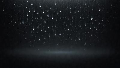 The primary subject of the image is a rainy scene with a dark background. The setting is a rainy day, and the visual style is a black and white photo. The colors and mood of the image are predominantly dark and moody, with the rain creating a sense of gloominess.