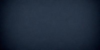 The primary subject of the image is a blue cloth, which is the main object, scene, or focus of the image. The setting or background is a dark blue surface, and the visual style is a photo. The colors and mood of the image are predominantly dark blue, creating a calm and serene atmosphere.