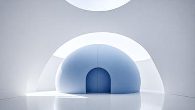 The primary subject of the image is a blue doorway in a white room. The setting is a large, open space with a white background. The visual style is a photo, and the colors and mood are predominantly white and blue, creating a clean and minimalist atmosphere.