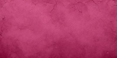 The primary subject of the image is a close-up of a maroon-colored wall with a rough texture. The setting is a room with a red brick wall, and the visual style is a photo. The dominant colors in the image are red and brown, creating a warm and earthy atmosphere.