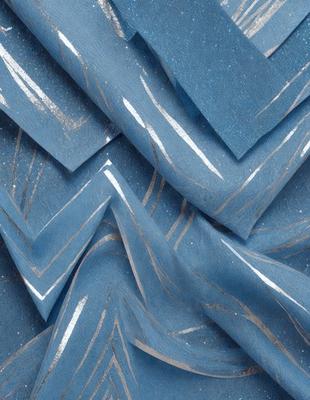 The primary subject of the image is a blue and white striped fabric. The setting is a close-up of the fabric, showcasing its intricate design. The visual style is a combination of a photo and digital art, creating a unique and eye-catching pattern. The dominant colors are blue and white, giving the image a clean and modern appearance.