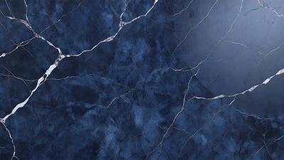 The primary subject of the image is a blue marble wall with a cracked and textured surface. The setting is a room with a blue-toned atmosphere. The visual style is a close-up of the marble wall, showcasing its unique texture and color. The colors and mood of the image are predominantly blue, creating a calm and serene ambiance.