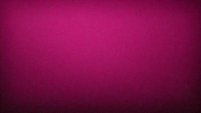 The primary subject of the image is a large, pink surface. The setting is a dark background, which contrasts with the bright pink color of the surface. The visual style appears to be a close-up of the pink surface, possibly a photo or a digital art piece. The colors and mood of the image are predominantly pink, creating a warm and vibrant atmosphere.