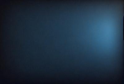 The primary subject of the image is a dark blue sky with no clouds. The setting is a vast, open space with no visible landmarks or objects. The visual style is a simple, clean, and minimalistic representation of the sky. The colors and mood convey a sense of calmness and tranquility.