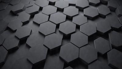 The primary subject of the image is a black and white pattern of hexagons. The setting is a black background, and the visual style appears to be a digital art or illustration. The dominant colors are black and white, creating a bold and striking pattern. The overall atmosphere of the image is modern and minimalistic.