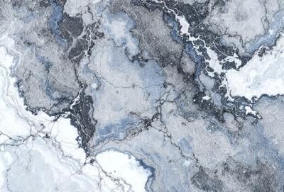 The primary subject of the image is a marble surface with a blue and white pattern. The setting is a stone wall, and the visual style is a close-up of the marble pattern. The colors and mood of the image are predominantly blue and white, creating a calm and elegant atmosphere.