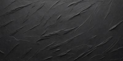 The primary subject of the image is a black background with a pattern of long, thin, curved lines. The setting appears to be a dark room, and the visual style is a combination of a photo and a drawing. The colors in the image are predominantly black, and the overall atmosphere is somewhat mysterious and intriguing.