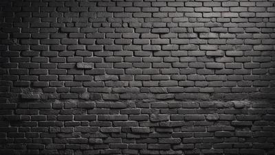 The primary subject of the image is a brick wall. The setting is a dark room, and the visual style is a photo. The brick wall is the main focus of the image, and the dominant colors are black and brown. The overall atmosphere is moody and dramatic.
