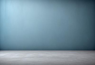 The primary subject of the image is a large, empty room with a blue wall. The setting is a plain, white room with a blue wall, and the visual style is a photo. The colors and mood of the image are predominantly blue, creating a calm and serene atmosphere.