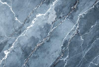 The primary subject of the image is a marble tile with a blue and white color scheme. The setting is a bathroom, as indicated by the presence of the marble tile. The visual style is a close-up of the tile, showcasing its intricate design and texture. The colors and mood of the image are predominantly blue and white, creating a clean and elegant atmosphere.