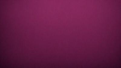 The primary subject of the image is a large, purple wall. The setting is a room with a purple background, which creates a unique and striking visual effect. The visual style of the image is a close-up of the purple wall, emphasizing its color and texture. The dominant colors in the image are purple, which creates a calm and soothing atmosphere.